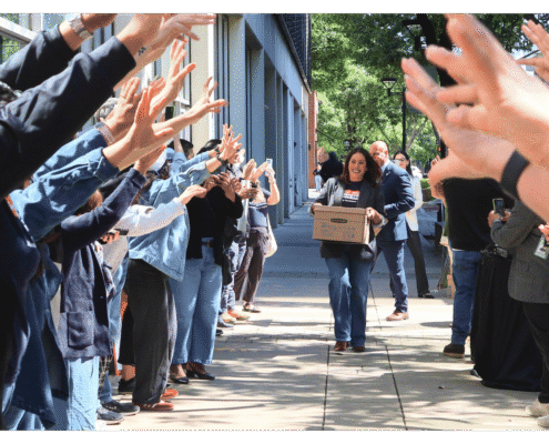 Veronica Garibay walks one of fifteen boxes comprising of the 32,000 signatures collected by Better Roads, Safe Streets to advance the Better Roads, Safe Streets transportation measure