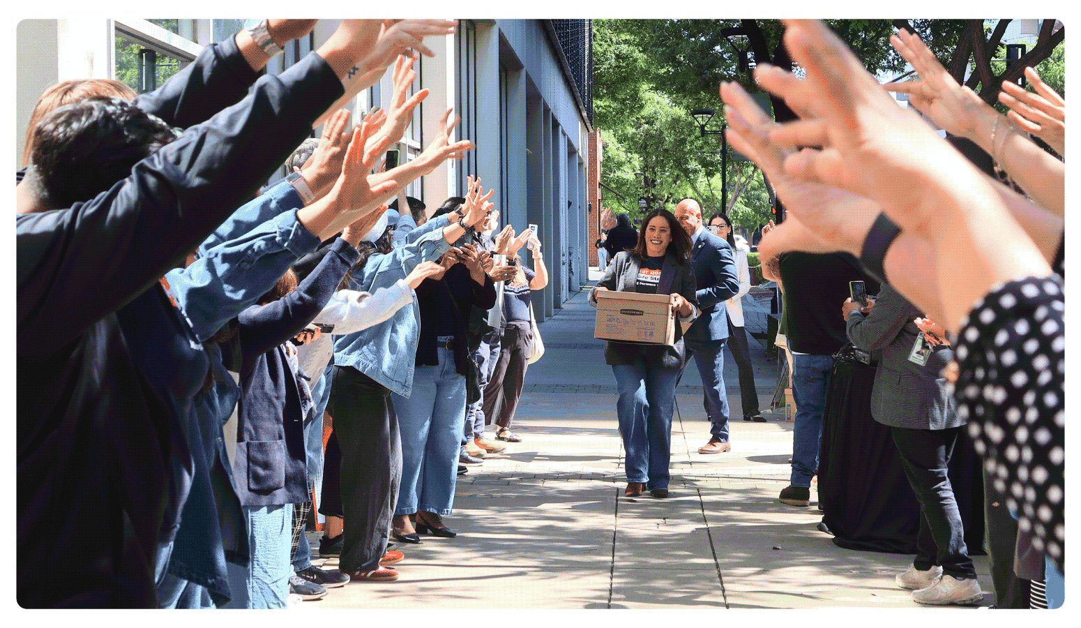 Veronica Garibay walks one of fifteen boxes comprising of the 32,000 signatures collected by Better Roads, Safe Streets to advance the Better Roads, Safe Streets transportation measure