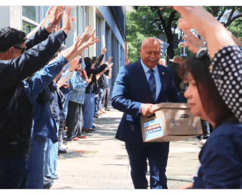 Mayor of Fresno Jerry Dyer walks one of fifteen boxes comprising of the 32,000 signatures collected by Better Roads, Safe Streets to advance the Better Roads, Safe Streets transportation measure