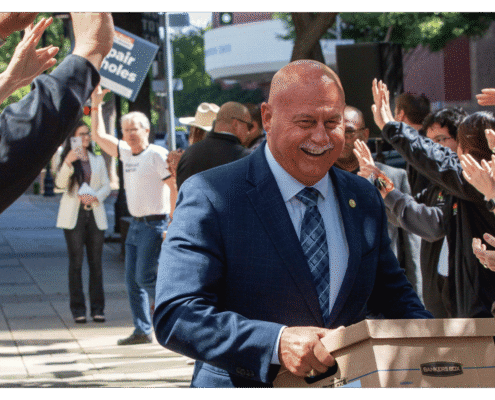 Mayor of Fresno Jerry Dyer walks one of fifteen boxes comprising of the 32,000 signatures collected by Better Roads, Safe Streets to advance the Better Roads, Safe Streets transportation measure