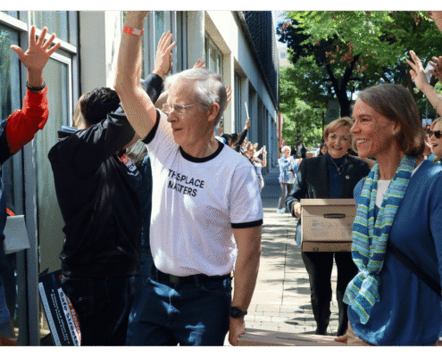 Advocate walks one of fifteen boxes comprising of the 32,000 signatures collected by Better Roads, Safe Streets to advance the Better Roads, Safe Streets transportation measure