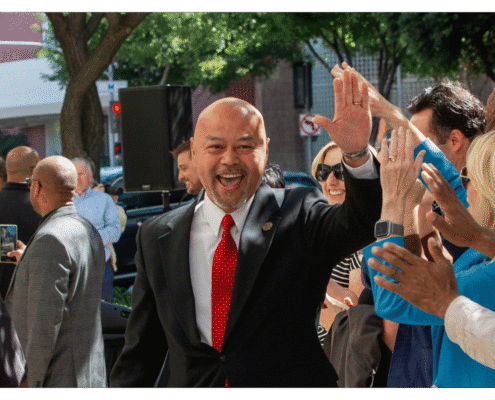 Mayor of Clovis Vong Mouanoutoua walks one of fifteen boxes comprising of the 32,000 signatures collected by Better Roads, Safe Streets to advance the Better Roads, Safe Streets transportation measure