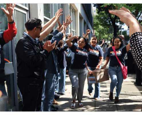 Sandra Celedon and Fresno BHC Staff walk one of fifteen boxes comprising of the 32,000 signatures collected by Better Roads, Safe Streets to advance the Better Roads, Safe Streets transportation measure