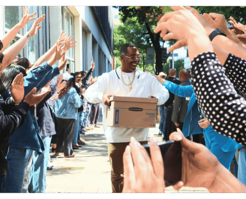 Advocate walks one of fifteen boxes comprising of the 32,000 signatures collected by Better Roads, Safe Streets to advance the Better Roads, Safe Streets transportation measure
