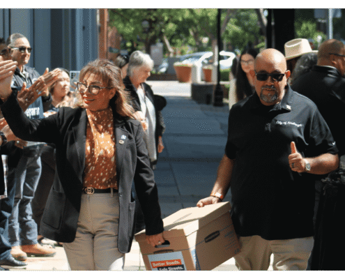 Advocates walk one of fifteen boxes comprising of the 32,000 signatures collected by Better Roads, Safe Streets to advance the Better Roads, Safe Streets transportation measure
